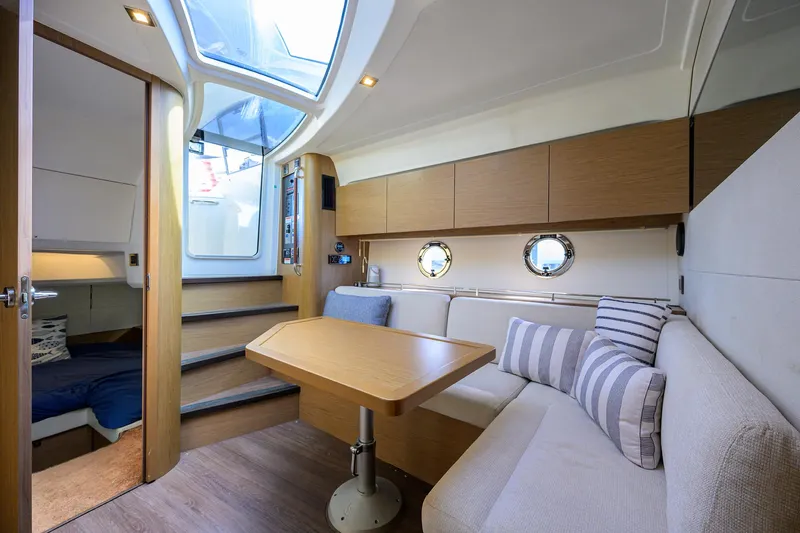  Yacht Photos Pics Interior of 2015 Beneteau 38 GT yacht with cozy seating and modern design.