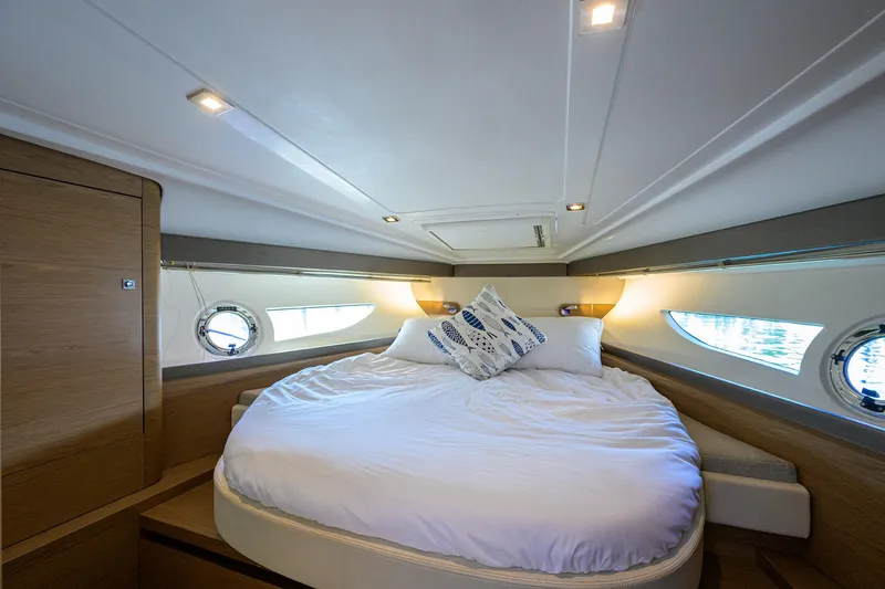  Yacht Photos Pics Luxurious cabin interior of 2015 Beneteau 38 GT yacht with round bed.