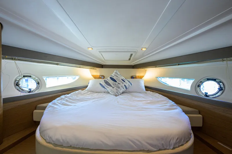  Yacht Photos Pics Luxurious bedroom interior of 2015 Beneteau 38 GT yacht with round bed.