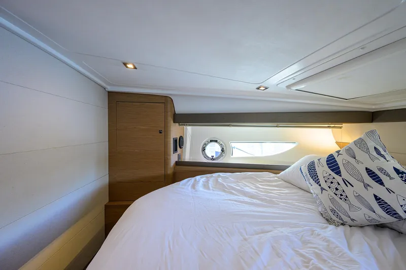  Yacht Photos Pics Luxurious cabin interior of 2015 Beneteau 38 GT yacht with cozy bedding.