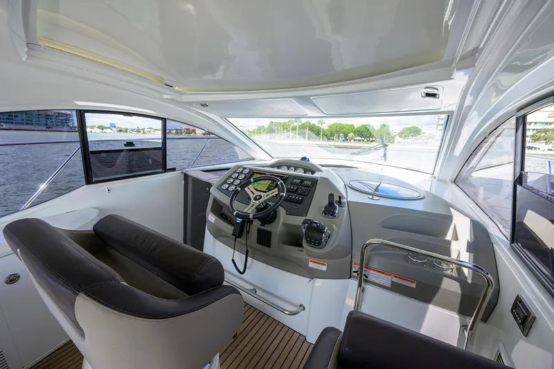  Yacht Photos Pics Interior cockpit of 2015 Beneteau 38 GT yacht with modern controls and seating.