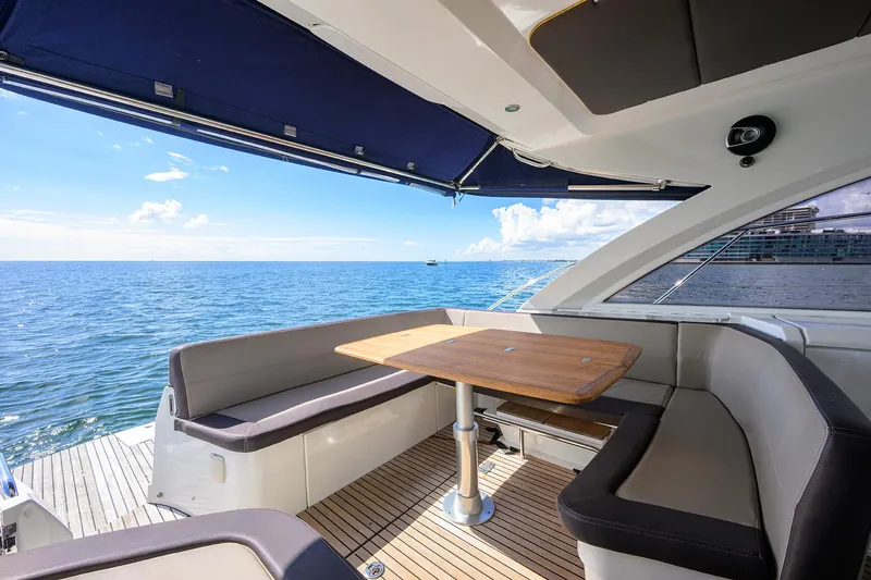  Yacht Photos Pics Beneteau 38 GT 2015 yacht interior with ocean view and seating area.