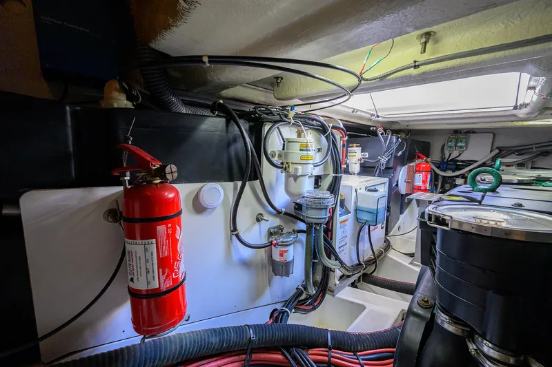  Yacht Photos Pics Engine room of 2015 Beneteau 38 GT with fire extinguisher and wiring.