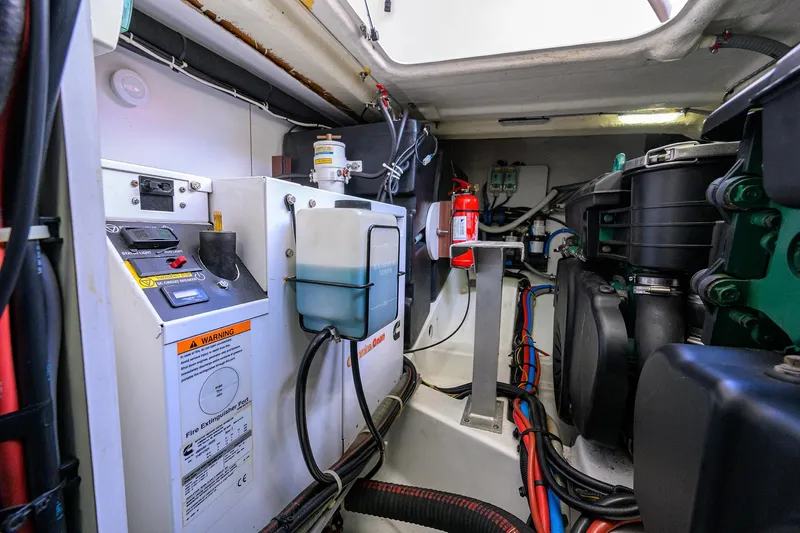  Yacht Photos Pics Engine room of 2015 Beneteau 38 GT with mechanical equipment and wiring.