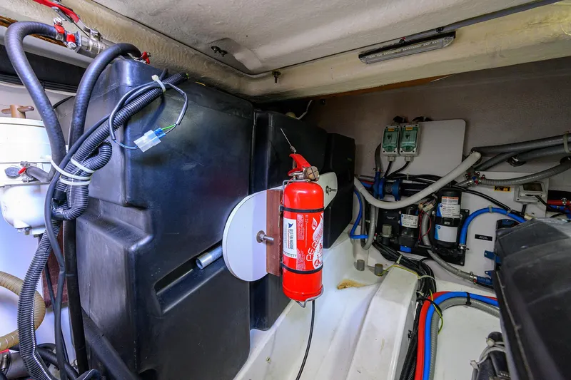  Yacht Photos Pics Engine room of 2015 Beneteau 38 GT with fire extinguisher and wiring.