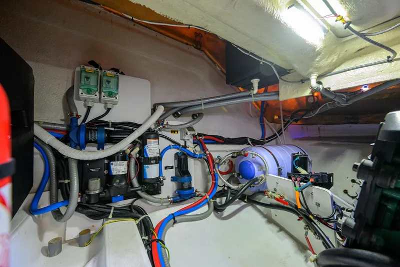  Yacht Photos Pics Engine room of 2015 Beneteau 38 GT yacht with wiring and equipment.