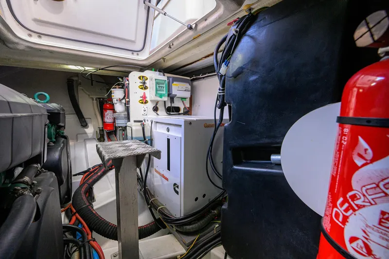  Yacht Photos Pics Engine room of 2015 Beneteau 38 GT with fire extinguisher and control panels.