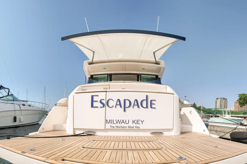 Escapade Yacht Photos Pics 2017 Tiara Yachts C44 Coupe named "Escapade" docked in a marina.