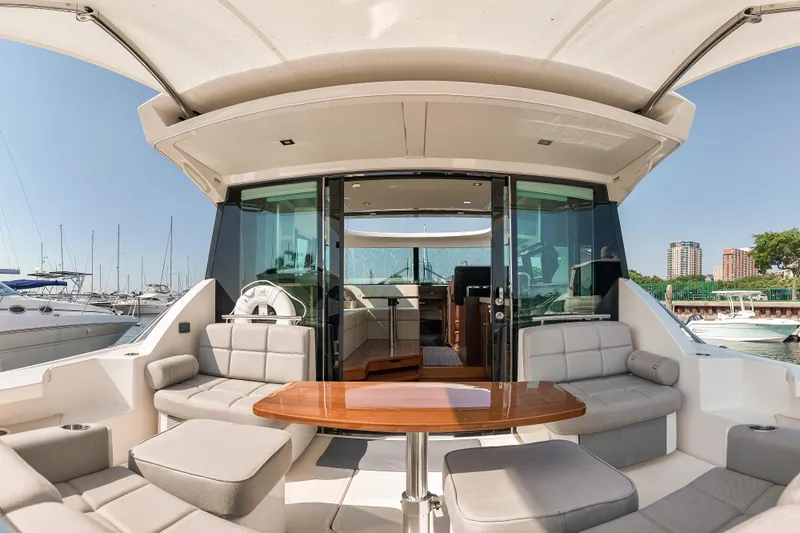 Escapade Yacht Photos Pics 2017 Tiara Yachts C44 Coupe with spacious seating and elegant interior design.