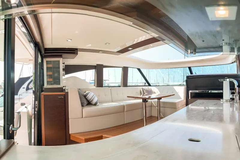 Escapade Yacht Photos Pics Luxurious interior of 2017 Tiara Yachts C44 Coupe with elegant seating and modern design.
