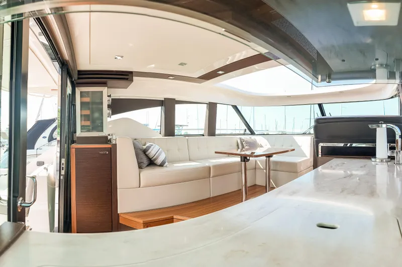 Escapade Yacht Photos Pics Luxurious interior of 2017 Tiara Yachts C44 Coupe with elegant seating and modern design.