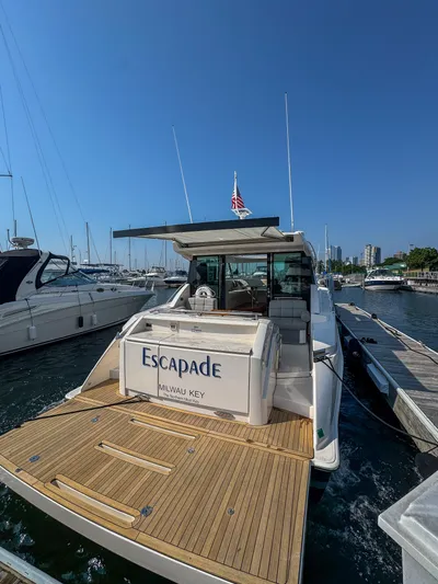 Escapade Yacht Photos Pics 2017 Tiara Yachts C44 Coupe docked at marina, rear view.