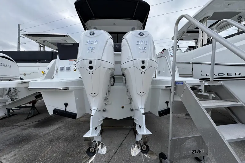  Yacht Photos Pics 2026 Jeanneau NC 1095 with dual Yamaha 300 V6 outboard engines, docked at marina.