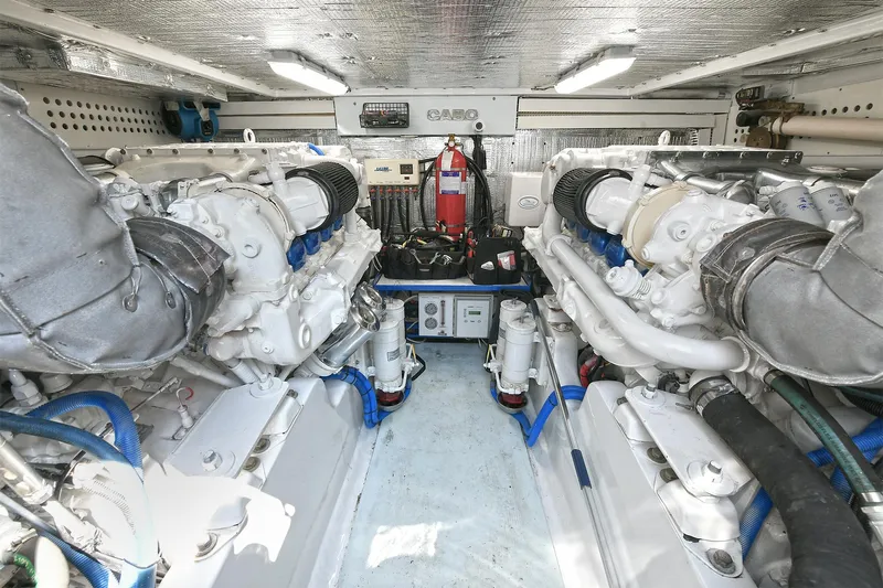  Yacht Photos Pics Engine room of 1999 Cabo 45 Express yacht, featuring dual engines and equipment.