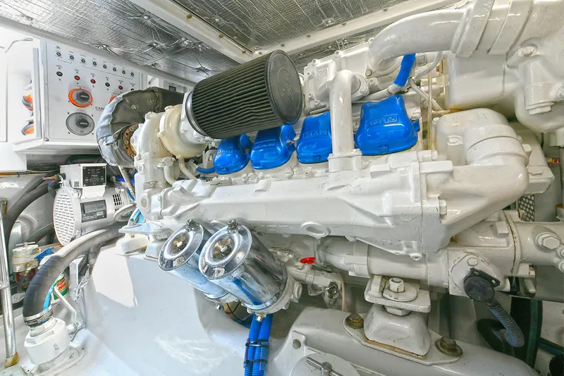 Yacht Photos Pics Engine room of a 1999 Cabo 45 Express boat, showcasing detailed machinery and components.