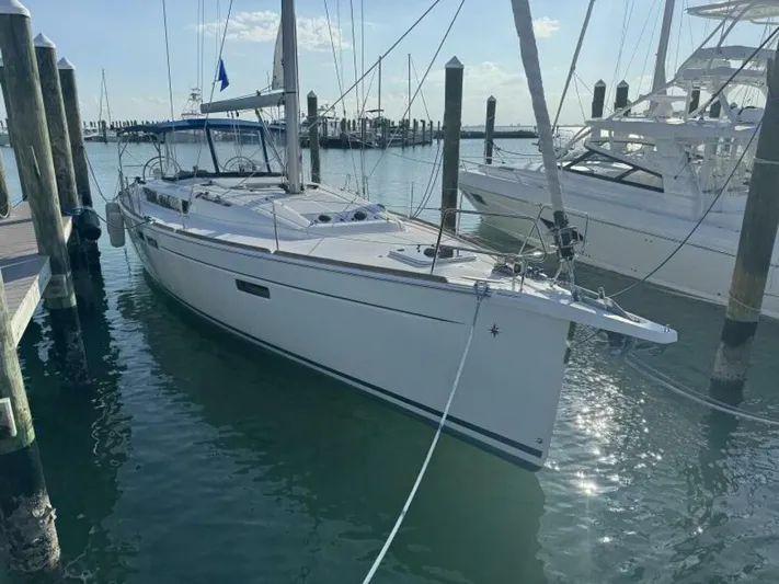 Levity Yacht Photos Pics 2019 Jeanneau Sun Odyssey 479 sailboat docked in a marina.
