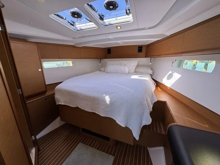 Levity Yacht Photos Pics Luxurious cabin interior of 2019 Jeanneau Sun Odyssey 479 yacht with skylights and cozy bed.
