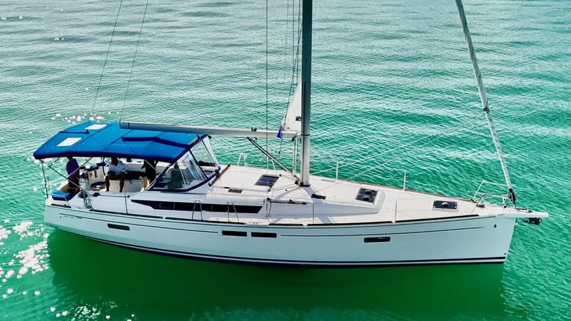 Levity Yacht Photos Pics 2019 Jeanneau Sun Odyssey 479 sailing on clear turquoise water.