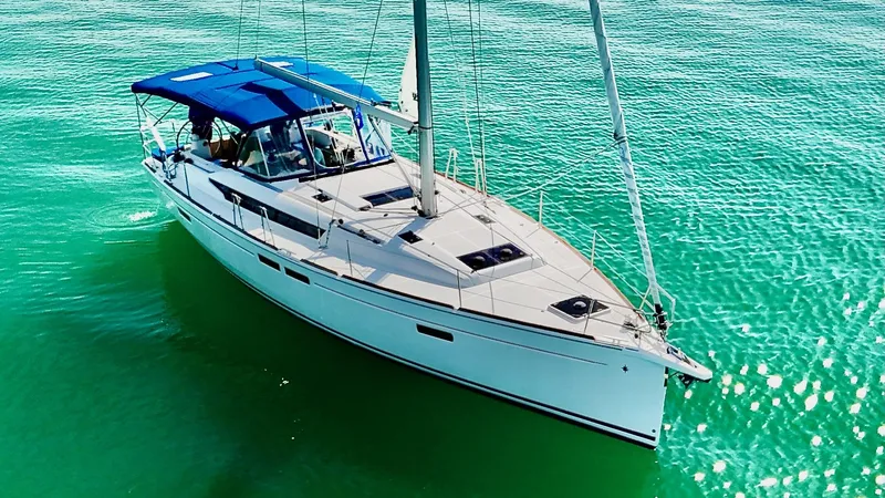 Levity Yacht Photos Pics 2019 Jeanneau Sun Odyssey 479 sailing on clear turquoise waters.