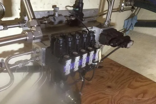 Horus Yacht Photos Pics Engine room of 2013 Custom Trawler 45 with hydraulic system components.