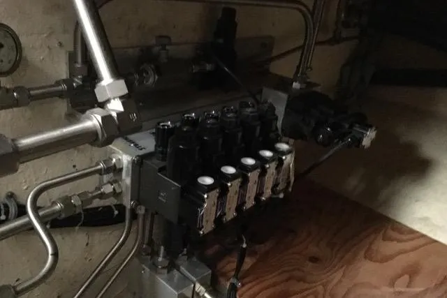 Horus Yacht Photos Pics Engine room of 2013 Custom Trawler 45 with hydraulic system components.