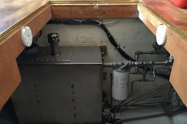 Horus Yacht Photos Pics Engine compartment of 2013 Custom Trawler 45, featuring fuel tank and filtration system.