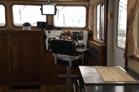 Horus Yacht Photos Pics Interior of 2013 Custom Trawler 45, featuring helm station and navigation equipment.