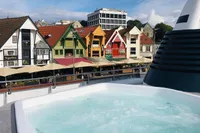 Rooftop hot tub with colorful buildings in the background, Custom GLOBAL ENGINEERING, 1966.