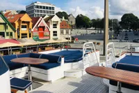 Rooftop view of colorful buildings and street from a 1966 Custom GLOBAL ENGINEERING yacht deck.