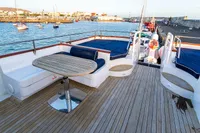 Luxurious 1966 Custom GLOBAL ENGINEERING yacht deck with seating and ocean view.