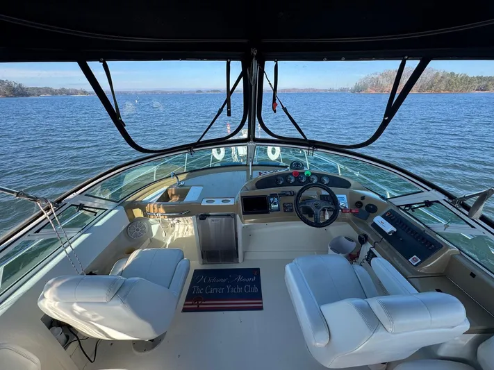  Yacht Photos Pics Interior view of 2004 Carver 360 Mariner yacht cockpit with scenic water backdrop.
