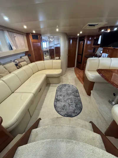  Yacht Photos Pics Luxurious interior of a 2004 Carver 360 Mariner yacht with plush seating and elegant design.