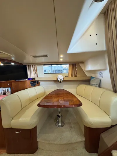  Yacht Photos Pics 2004 Carver 360 Mariner interior with elegant dining area and plush seating.