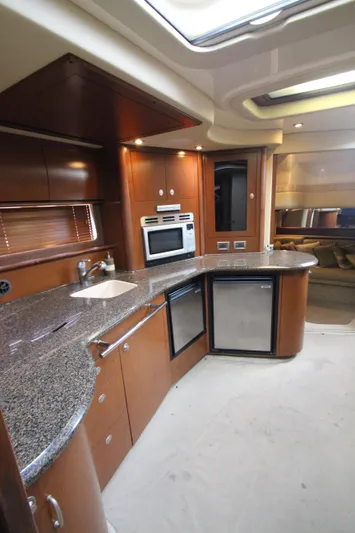  Yacht Photos Pics Luxurious kitchen interior of 2007 Sea Ray 44 Sundancer yacht with modern appliances.