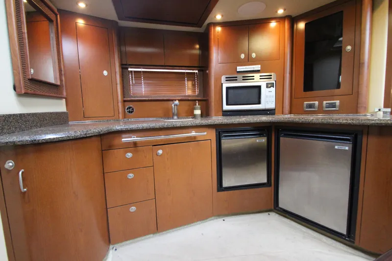  Yacht Photos Pics Luxurious kitchen interior of 2007 Sea Ray 44 Sundancer yacht with modern appliances.
