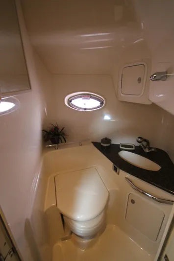  Yacht Photos Pics 2007 Sea Ray 44 Sundancer yacht bathroom with modern fixtures and porthole window.