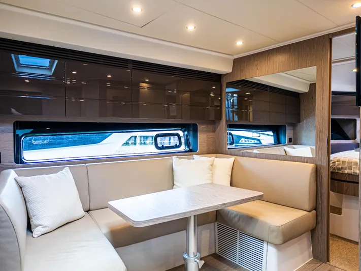  Yacht Photos Pics Luxurious interior of 2020 Azimut Atlantis 45 yacht with modern seating and windows.