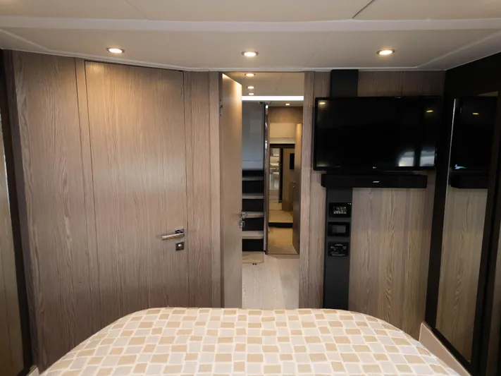  Yacht Photos Pics Interior of 2020 Azimut Atlantis 45 yacht with modern wood paneling and mounted TV.