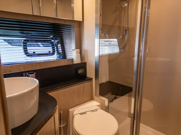  Yacht Photos Pics Luxurious bathroom in 2020 Azimut Atlantis 45 yacht with modern fixtures and shower.