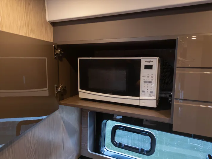  Yacht Photos Pics Microwave in Azimut Atlantis 45 yacht kitchen, 2020 model, with sleek cabinetry.