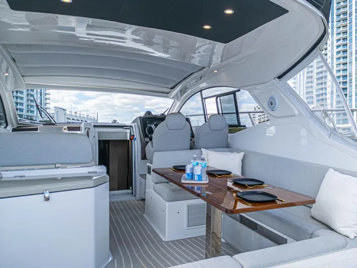  Yacht Photos Pics Luxurious interior of 2020 Azimut Atlantis 45 yacht with elegant seating and dining area.