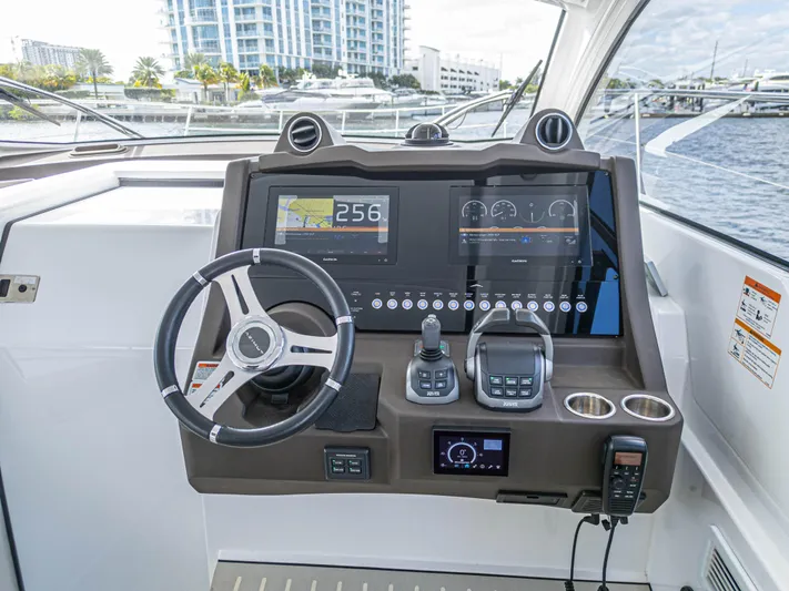 Yacht Photos Pics Azimut Atlantis 45 yacht helm, featuring modern navigation controls and dual displays, 2020 model.