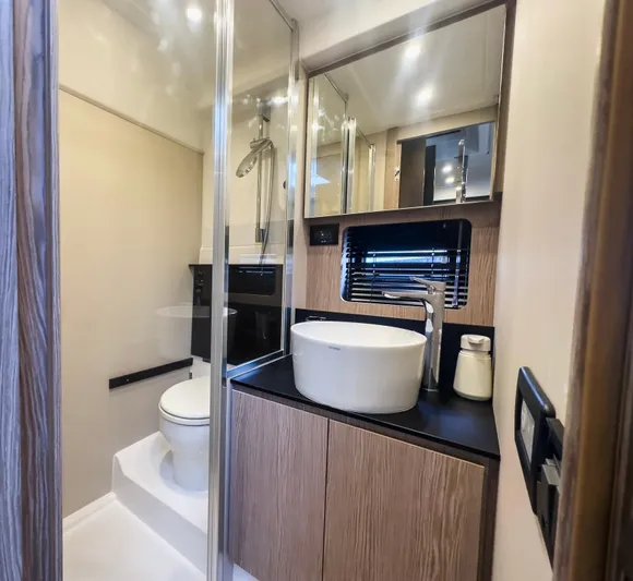  Yacht Photos Pics Luxurious bathroom in 2020 Azimut Atlantis 45 yacht with modern fixtures and elegant design.