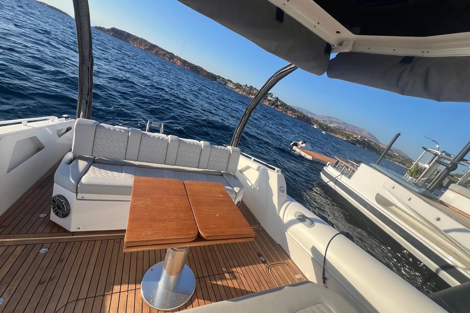Luxurious 2022 Skipper NC 42 yacht interior with wooden deck and ocean view.