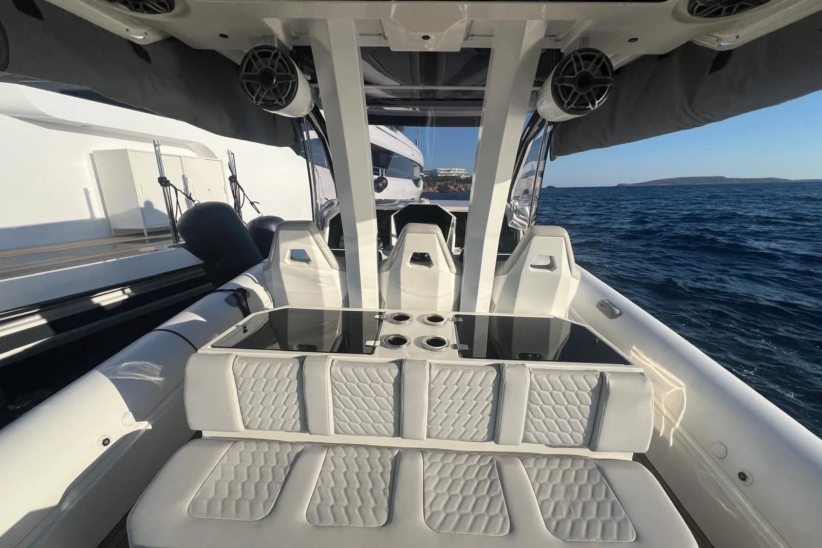 Luxurious 2022 Skipper NC 42 boat interior with cushioned seating and ocean view.