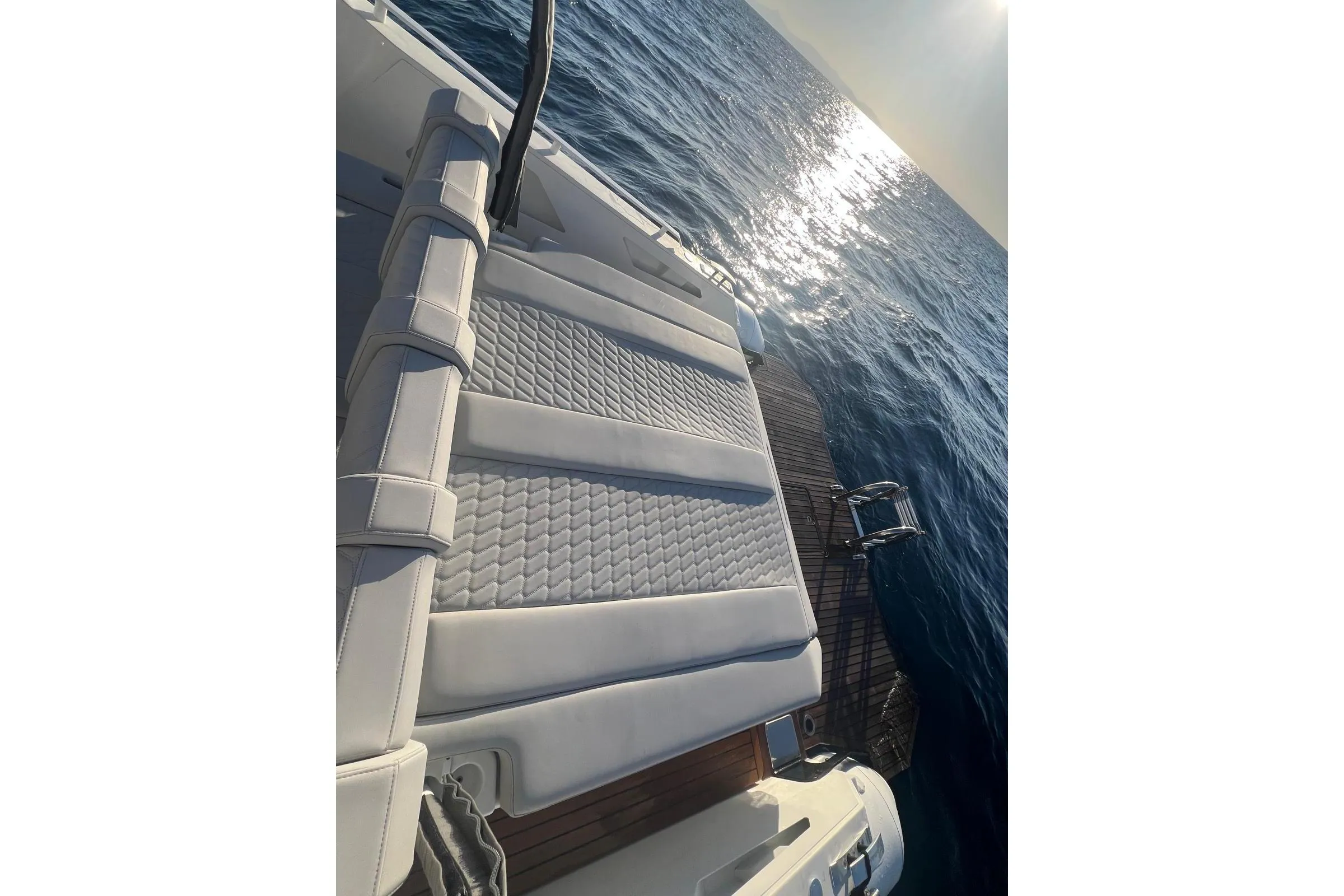 Luxurious seating on 2022 Skipper NC 42 yacht, overlooking sparkling ocean waters.