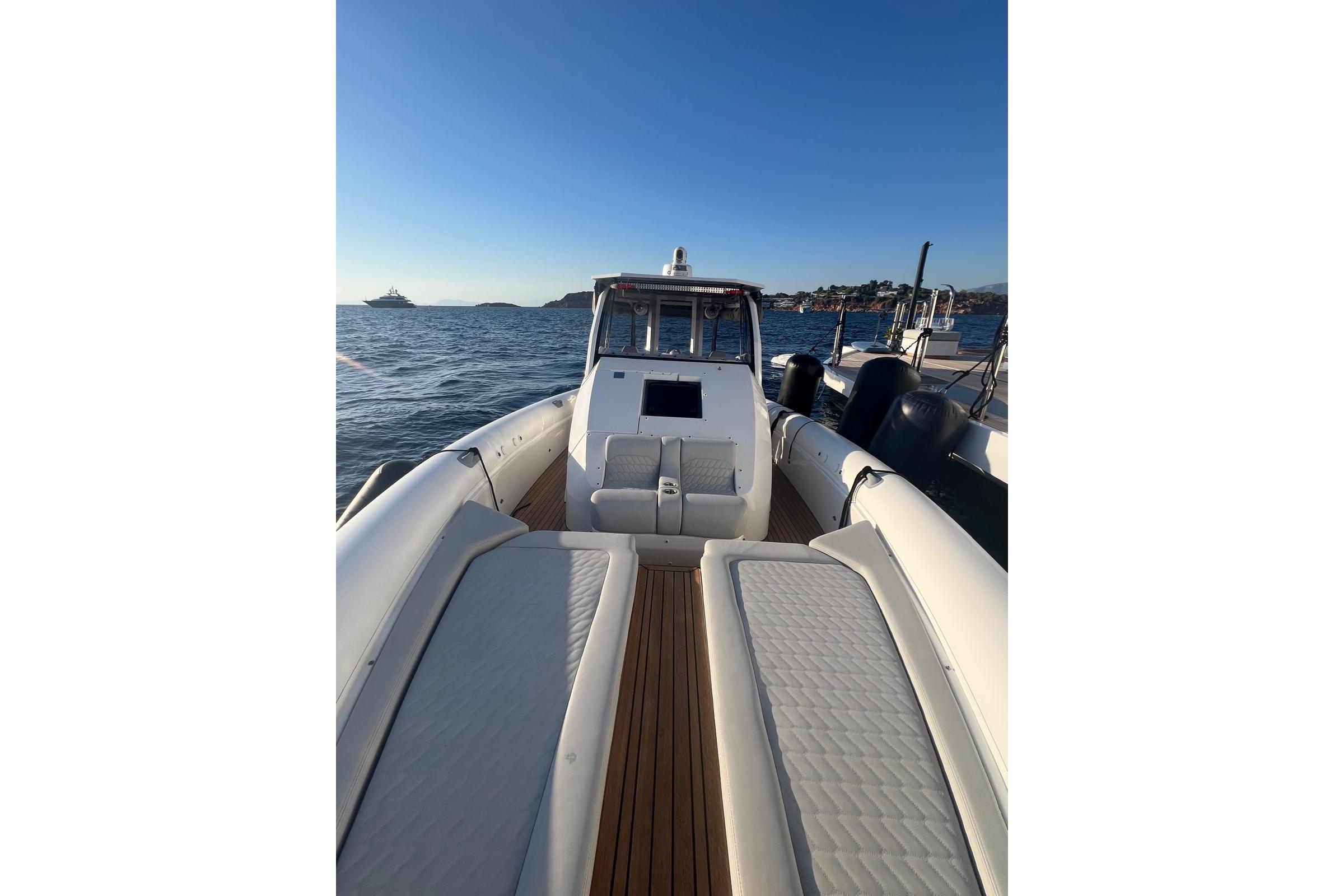 2022 Skipper NC 42 boat on water, featuring spacious deck and seating.