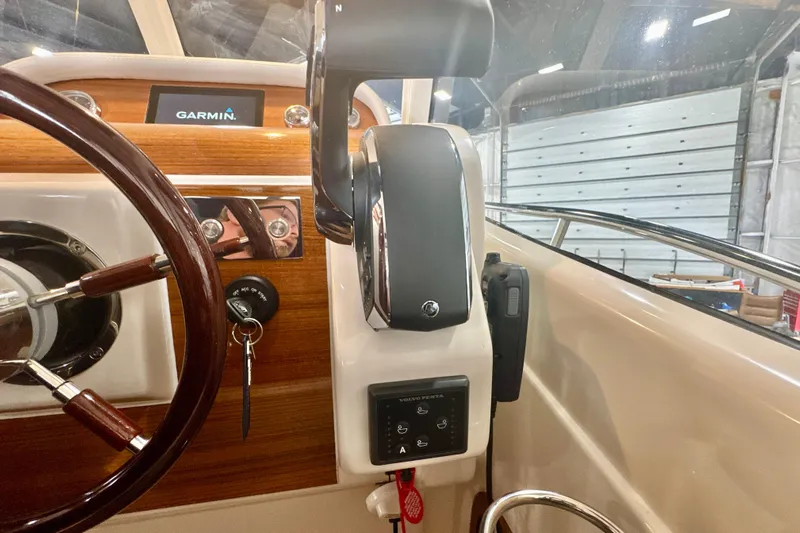  Yacht Photos Pics 2024 DaVinci 30HT boat helm with Garmin display and wooden steering wheel.