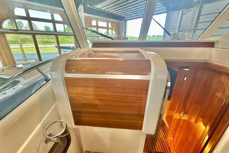  Yacht Photos Pics 2024 DaVinci 30HT yacht interior with polished wood and sleek design elements.