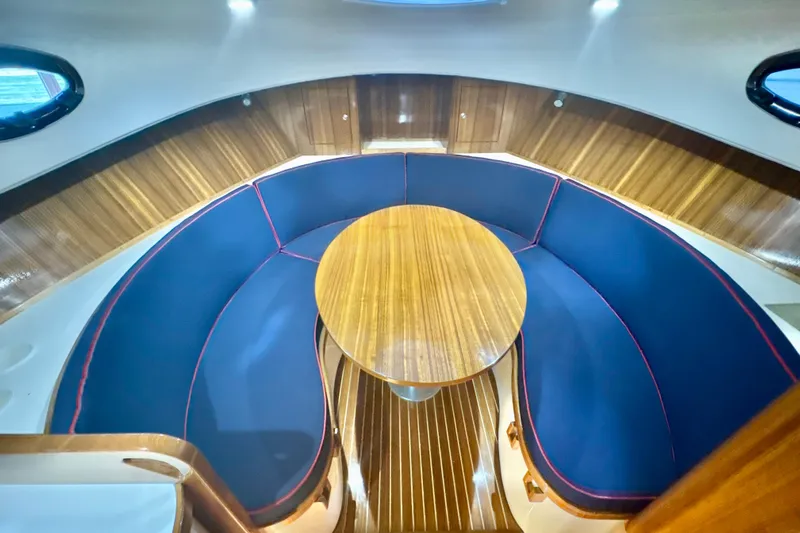  Yacht Photos Pics Luxurious interior of 2024 DaVinci 30HT yacht with elegant wood and blue seating.